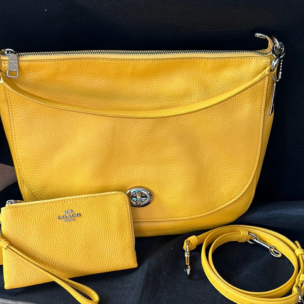 Leather Coach bag and matching wallet.  Bag measures roughly 14”x4.5”x 10”.